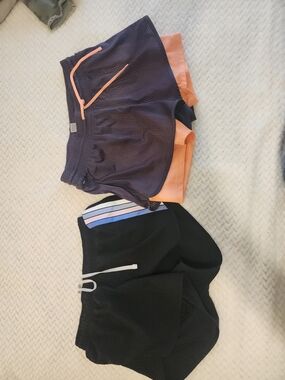 2 Pair Of Womens Athleric Shorts in Navy and Peach And Black & Blue